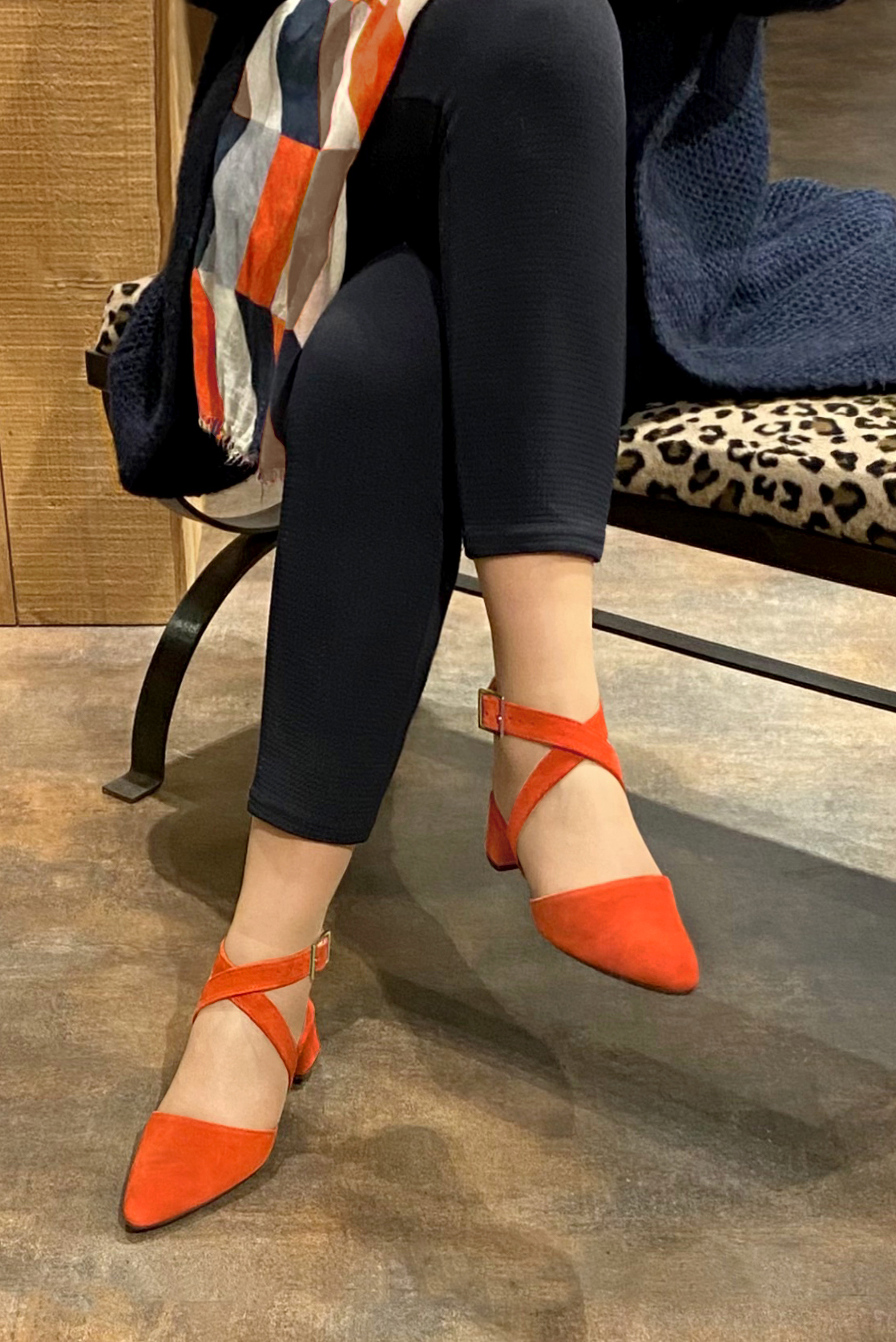 Clementine orange women's open back shoes, with crossed straps. Tapered toe. Low flare heels. Worn view - Florence KOOIJMAN